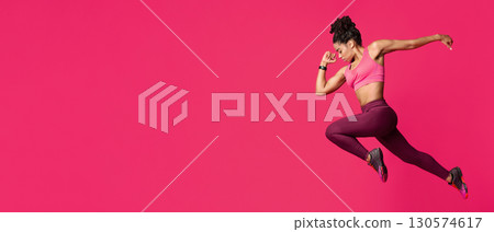 Athletic african american girl runner over red studio background, sport concept, free space 130574617