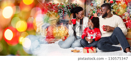 Christmas snack. Joyful african american family drinking milk and eating cookies, celebrating Xmas at home together. Christmas snack. Joyful african american family drinking milk and eating cookies, celebrating Xmas at home together. 130575347