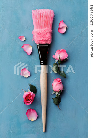 Creative flat lay with fluffy pink makeup brush blooming pink roses on light blue wooden background. Feminine beauty concept. 130575962