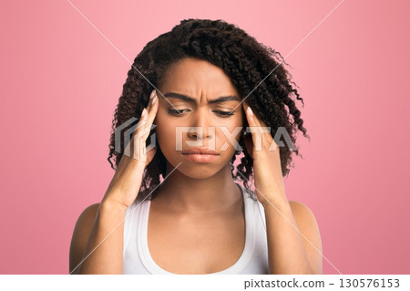 Headache Concept. Black woman touching her temples, suffering from migraine, stress, copyspace, white background 130576153
