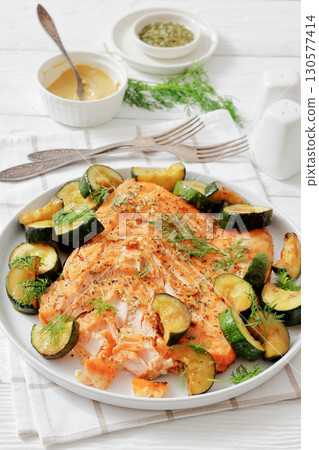 freshly baked salmon fillet with zucchini and dill 130577414