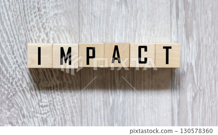 impact is a name made of wooden letters. Office desk impact is a name made of wooden letters. Office desk 130578360