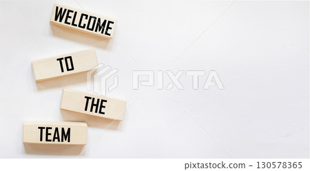 Welcome to the symbol of our team. Concept words Welcome to our team on wooden blocks. Welcome to the symbol of our team. Concept words Welcome to our team on wooden blocks. 130578365