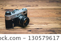Vintage Silver Film Camera on Wooden Table 130579617