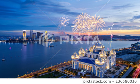Stunning Night Sky Display with Colorful Fireworks Over a Beautiful Coastal City and Riverfront Stunning Night Sky Display with Colorful Fireworks Over a Beautiful Coastal City and Riverfront 130580036