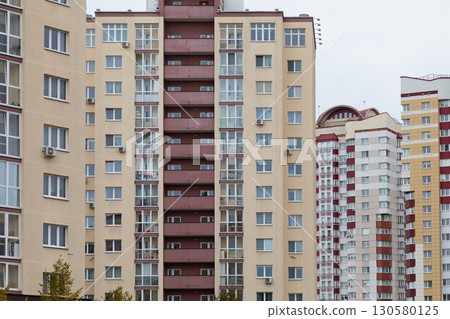 High-rise apartment buildings in a bustling residential area highlight living choices and property High-rise apartment buildings in a bustling residential area highlight living choices and property 130580125