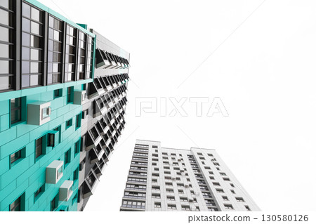 Modern high-rise apartment buildings in a residential area highlighting rental and mortgage options Modern high-rise apartment buildings in a residential area highlighting rental and mortgage options 130580126