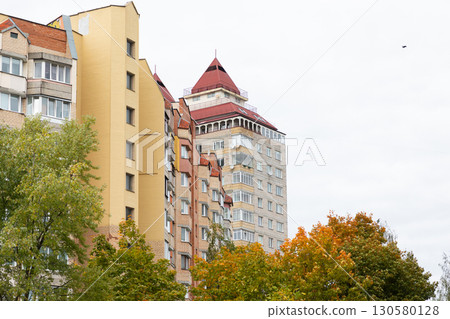 High-rise apartment buildings in a residential area showcasing modern architecture and vibrant High-rise apartment buildings in a residential area showcasing modern architecture and vibrant 130580128