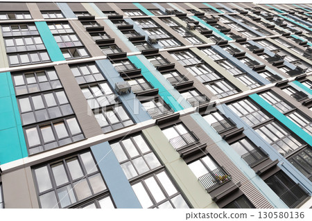 Colorful high-rise apartment buildings showcasing residential living options in a modern urban area 130580136