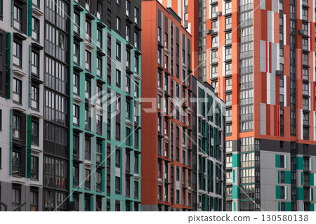 Modern high-rise apartment buildings in a vibrant residential area showcasing diverse architectural 130580138