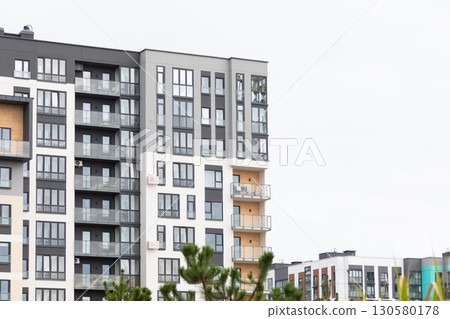 Modern high-rise apartment buildings in a thriving residential area with options for renting and 130580178