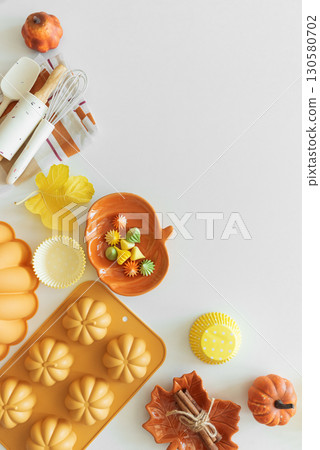 Autumn Baking Setup with Pumpkin Mold, Frosting and Seasonal Decorations Autumn Baking Setup with Pumpkin Mold, Frosting and Seasonal Decorations 130580702