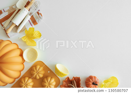 Autumn Baking Setup with Pumpkin Mold, Frosting and Seasonal Decorations Autumn Baking Setup with Pumpkin Mold, Frosting and Seasonal Decorations 130580707