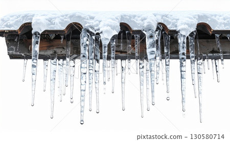 Icicles Hanging From Snowy Roof in Winter 130580714