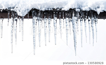 Close-up of Icicles Hanging from a Snowy Roof Close-up of Icicles Hanging from a Snowy Roof 130580928