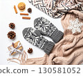 Cozy Winter Flatlay with Knitted Gloves and Scarf 130581052