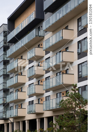 Modern high-rise apartment buildings in a residential area highlighting balcony designs and urban 130581094