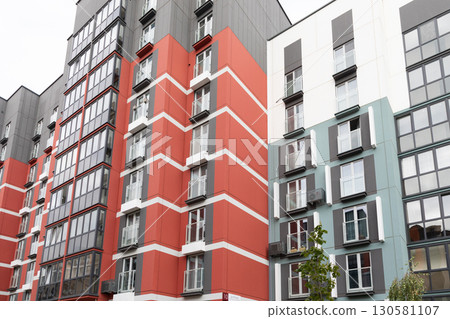 Modern high-rise apartment buildings in a residential area showcasing diverse designs and rental 130581107