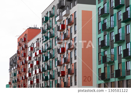 Colorful high-rise apartment buildings in a bustling urban residential area highlighting rent and Colorful high-rise apartment buildings in a bustling urban residential area highlighting rent and 130581122