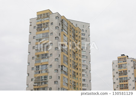 High-rise apartment buildings in a residential area highlight urban living, real estate trends, and 130581129