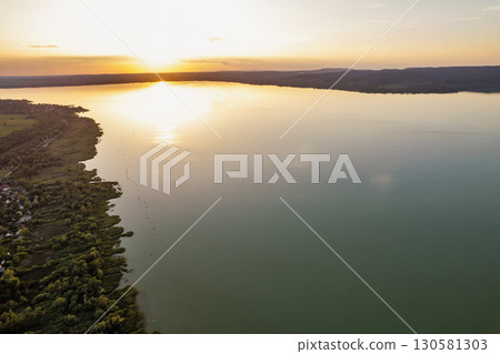 Spectacular sunset over lake Balaton with golden reflections, Hungary. 130581303