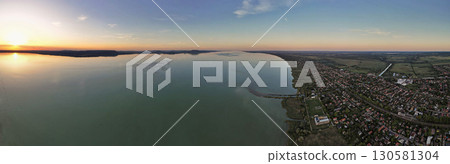 Spectacular sunset panorama over lake Balaton and Balatonmariafurdo town, Hungary. 130581304