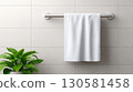 White Towel on Rack in Bathroom 130581458