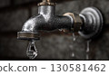 Leaking Faucet with Droplet Close-up 130581462
