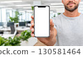 Man Holding Smartphone with Blank Screen 130581464