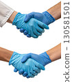 Two hands in blue medical gloves shaking hands, symbolizing healthcare collaboration and professional agreement 130581501