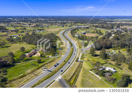 The Northern Road running through the suburb of Bringelly 130581838