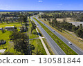 The Northern Road running through the suburb of Bringelly 130581844
