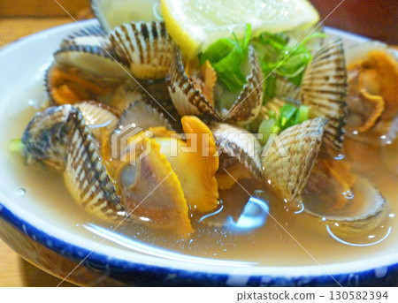 A photo of steamed ark shells in sake, an essential part of the Sanin New Year's osechi cuisine. 130582394