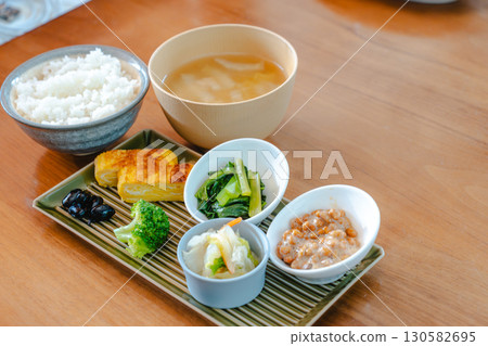 Japanese breakfast: rice, miso soup, natto and tamagoyaki Japanese breakfast: rice, miso soup, natto and tamagoyaki 130582695