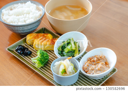 Japanese breakfast: rice, miso soup, natto and tamagoyaki Japanese breakfast: rice, miso soup, natto and tamagoyaki 130582696