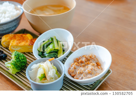 Japanese breakfast: rice, miso soup, natto and tamagoyaki Japanese breakfast: rice, miso soup, natto and tamagoyaki 130582705