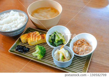 Japanese breakfast: rice, miso soup, natto and tamagoyaki Japanese breakfast: rice, miso soup, natto and tamagoyaki 130582709