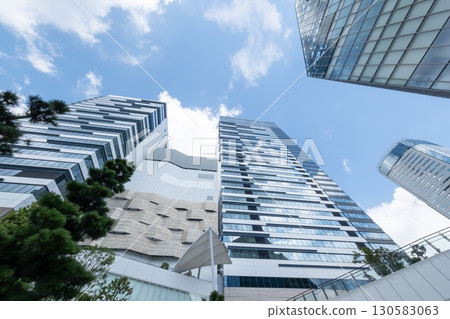 Landscape of the office town looking up at a skyscraper Landscape of the office town looking up at a skyscraper 130583063