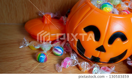 The Halloween bucket and candy for holiday concept The Halloween bucket and candy for holiday concept 130583859
