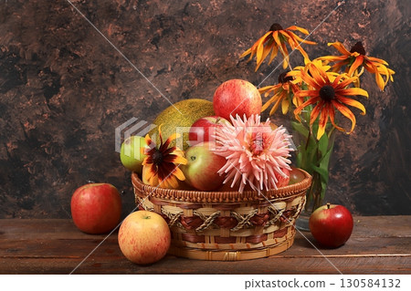Autumn harvest concept, old wooden table with pumpkins, melons, apples, pears and grapes, thanksgiving day background, healthy ecological food, rustic style, selective focus Autumn harvest concept, old wooden table with pumpkins, melons, apples, pears and grapes, thanksgiving day background, healthy ecological food, rustic style, selective focus 130584132