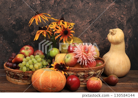 Autumn background with seasonal nature autumn berries, pumpkins, apples, grapes, melons and flowers on old background, copy space, Happy Thanksgiving concept, Autumn background with seasonal nature autumn berries, pumpkins, apples, grapes, melons and flowers on old background, copy space, Happy Thanksgiving concept, 130584144