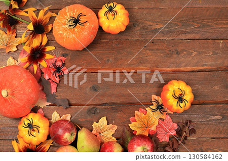 Happy Thanksgiving concept, postcard, Autumn background with seasonal pears, pumpkins, apples and flowers on wooden background, copy space, Harvesting, gifts of nature, selective focus. 130584162