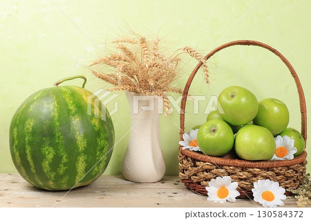 Thanksgiving day background, harvest concept, autumn composition with fruits, flowers and ears of wheat and rye, selective focus 130584372