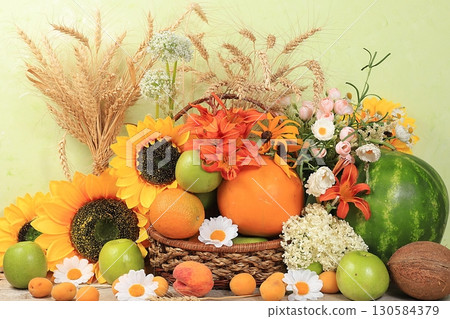 Thanksgiving, autumn background with seasonal nature autumn berries, watermelons, melons, wheat, apples and flowers on wooden background, top view, copy space, flat lay. Happy Thanksgiving concept, 130584379