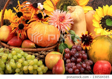 Autumn background with apples, pears, pumpkins, grapes, melons, sunflower flowers, plums in baskets on a wooden table, Thanksgiving concept, rustic harvest, Autumn background with apples, pears, pumpkins, grapes, melons, sunflower flowers, plums in baskets on a wooden table, Thanksgiving concept, rustic harvest, 130584385