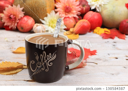 Autumn drink, seasonal composition, hot coffee with cinnamon in iron mugs on wooden background, copy space, Happy Thanksgiving concept, greeting card, selective focus 130584387