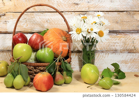 Thanksgiving background, harvest concept, autumn composition with fruits, natural berries, pumpkins, pears, apples, flowers on a wooden background, rustic style, selective focus 130584424
