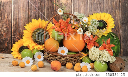 Autumn abstract composition with fruits and flowers, harvest concept and thanksgiving day, background, greeting card, selective focus, place for text. 130584425