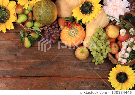 Happy Thanksgiving concept, autumn background with seasonal fall nature berries, pumpkins, melons, apples, grapes and flowers on wooden background, top view, copy space, flat lay. , selective focus. Happy Thanksgiving concept, autumn background with seasonal fall nature berries, pumpkins, melons, apples, grapes and flowers on wooden background, top view, copy space, flat lay. , selective focus. 130584446