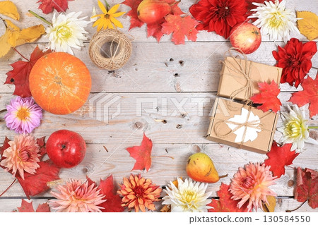 Happy Thanksgiving concept, postcard Autumn background with seasonal pears, pumpkins, apples and flowers on wooden background,selective focus. Harvesting, gifts of nature Happy Thanksgiving concept, postcard Autumn background with seasonal pears, pumpkins, apples and flowers on wooden background,selective focus. Harvesting, gifts of nature 130584550
